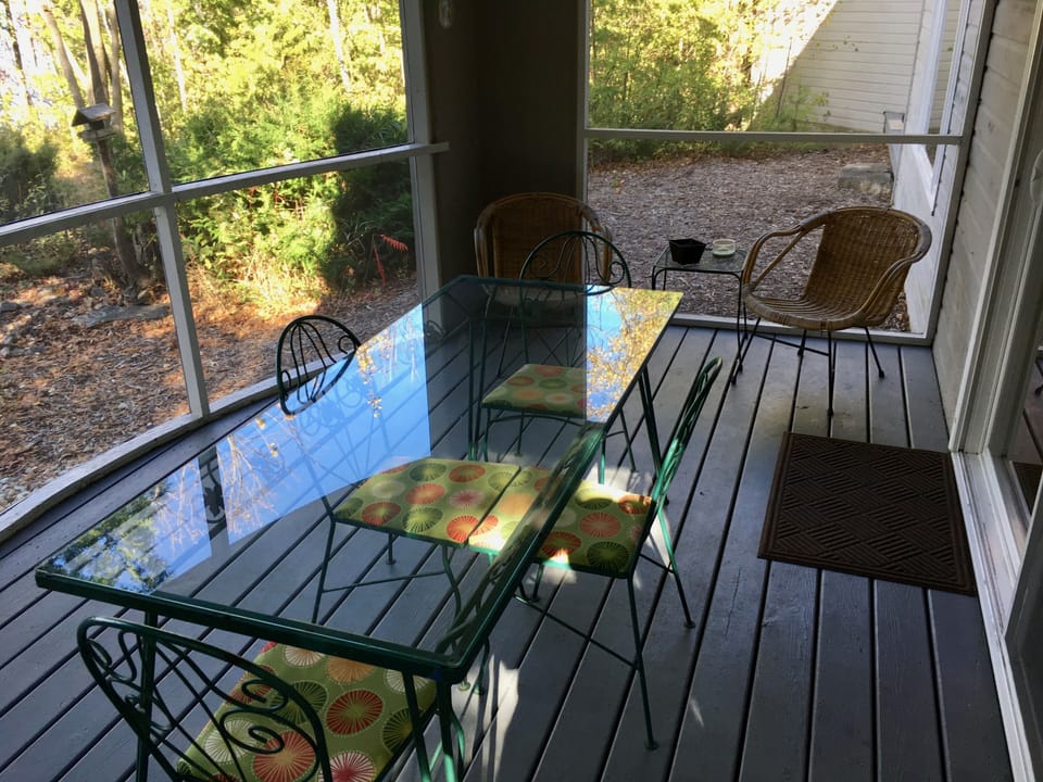 The screen porch faces the beach.