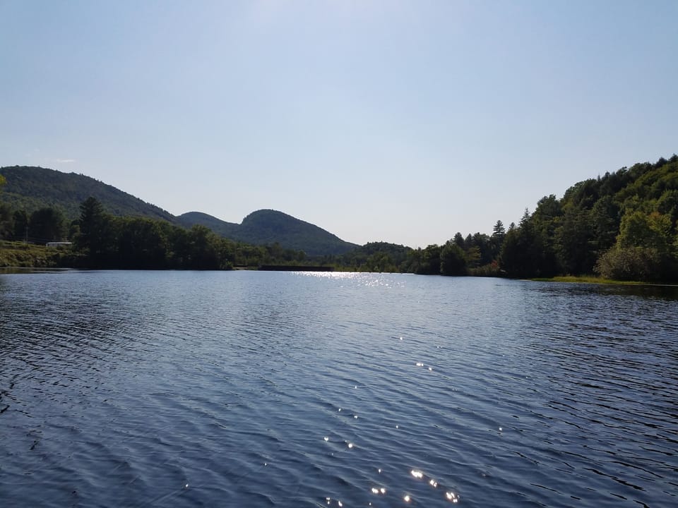 Downstream towards the dam view of the 3 sister mountains