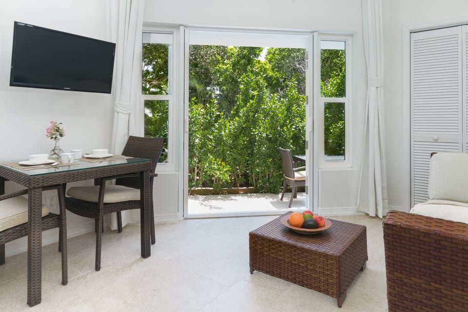 Experience the seamless connection between the dining and living area as they open up to the inviting exterior patio, creating an expansive and versatile space for relaxation and entertainment