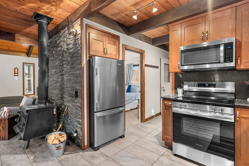 Full-size stainless-steel kitchen appliances.