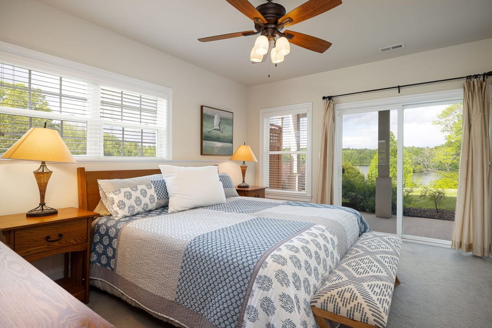 Master bedroom 2 with king bed, beautiful lake view and walkout to the lake