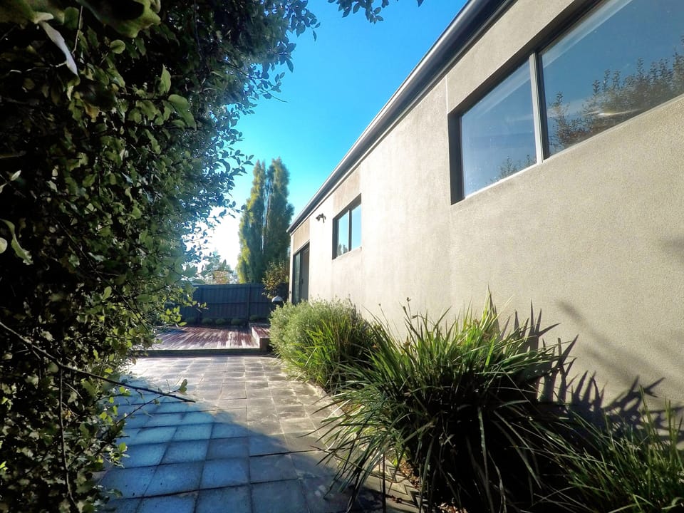 Looking over back pavers to Deck