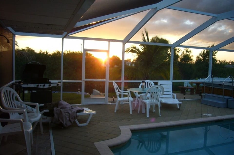 Grill, 2nd table, loungers, spa, pool, sunrise, overlook canal