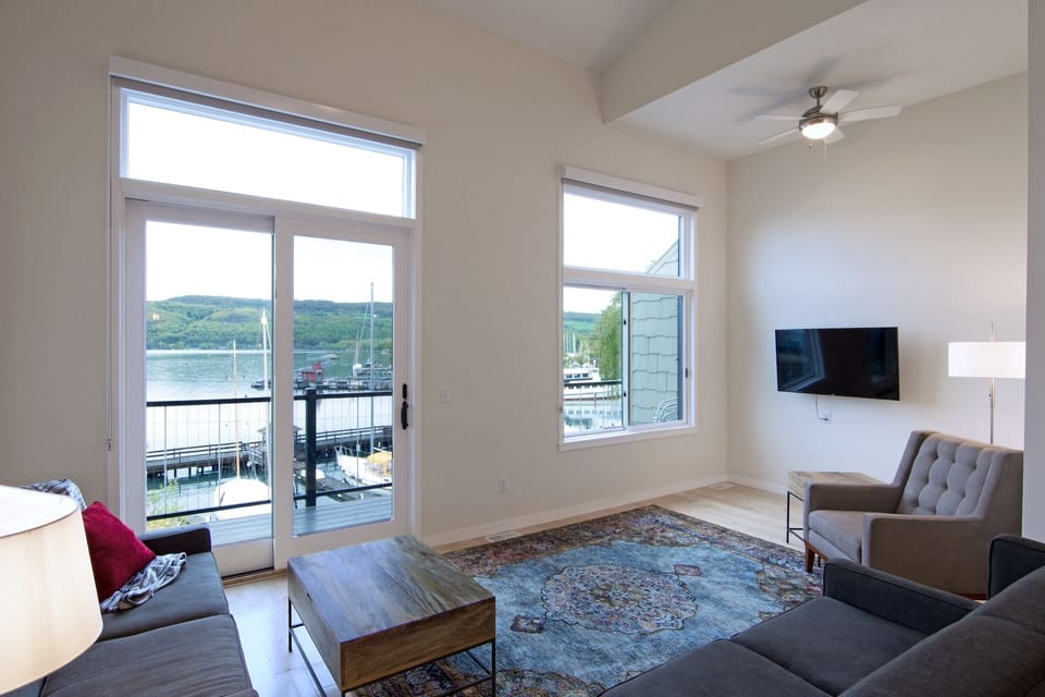 Livingroom with deck access and view of lake