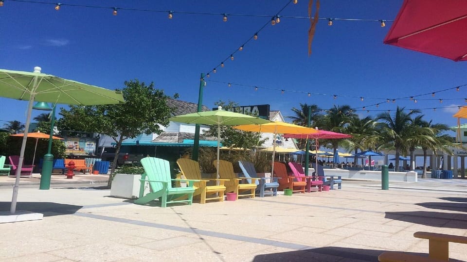 Enjoy a session or relaxation underneath one of these bright tropical umbrellas.