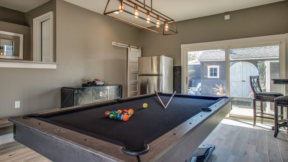 Pool/Ping Pong Table, Darts, extra fridge and plenty of seating space