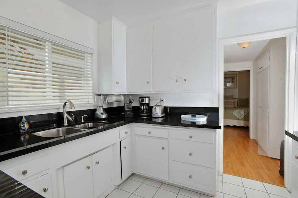 Fully equipped kitchen accented with granite counters