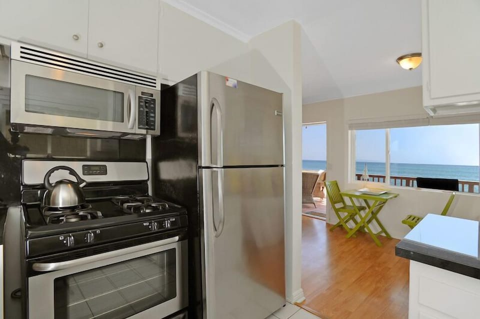 Kitchen with stainless steel appliances and ocean views