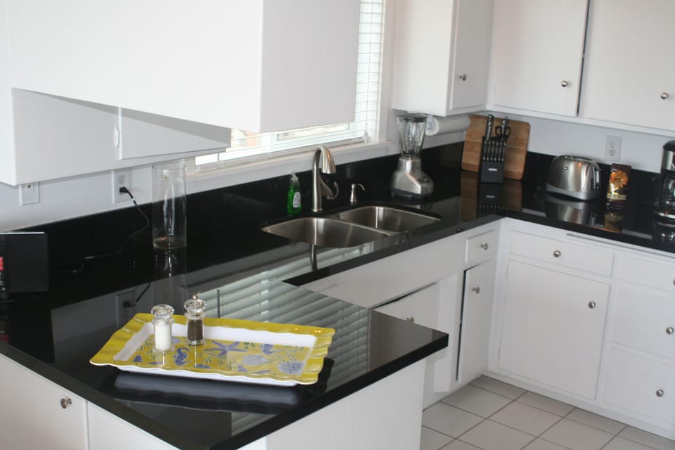 Kitchen with granite counters, stainless steel appliances and ocean views