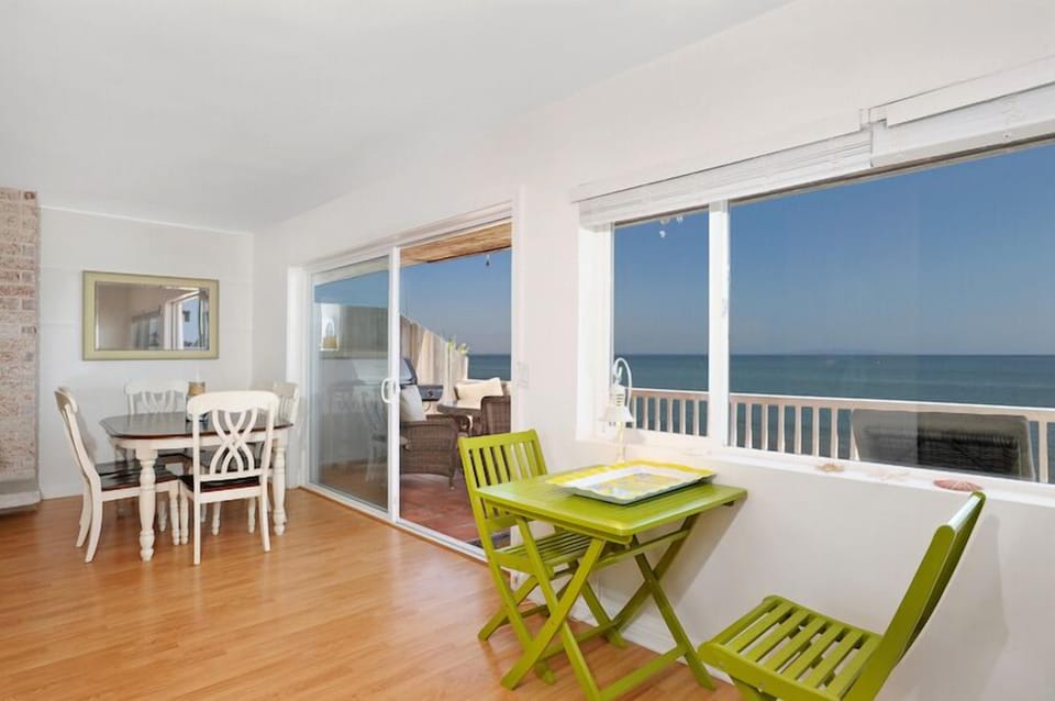 Dining and extra seating area with unobstructed ocean views