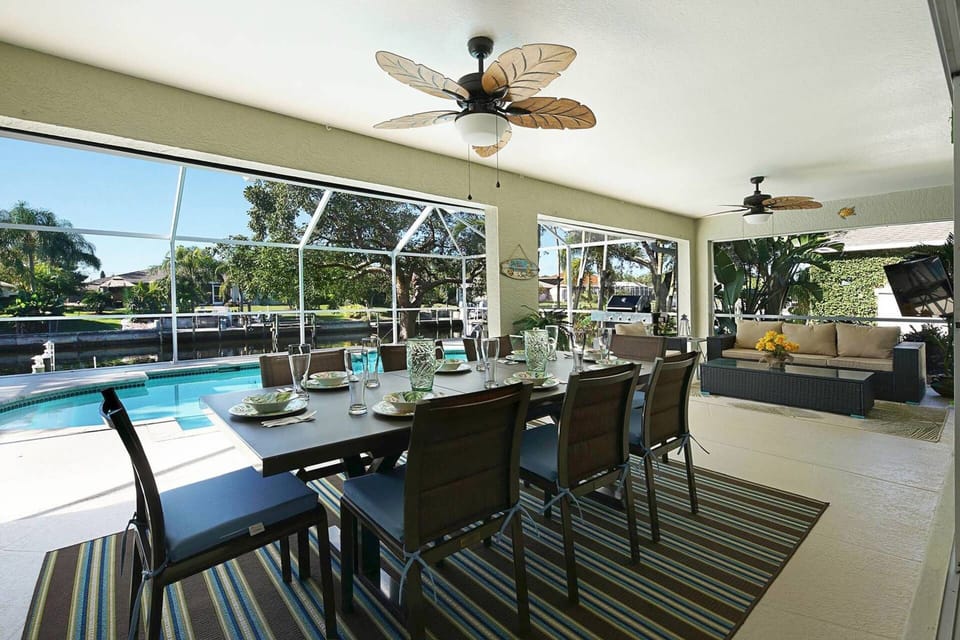 Enjoy meals poolside at the dining table with room for 8
