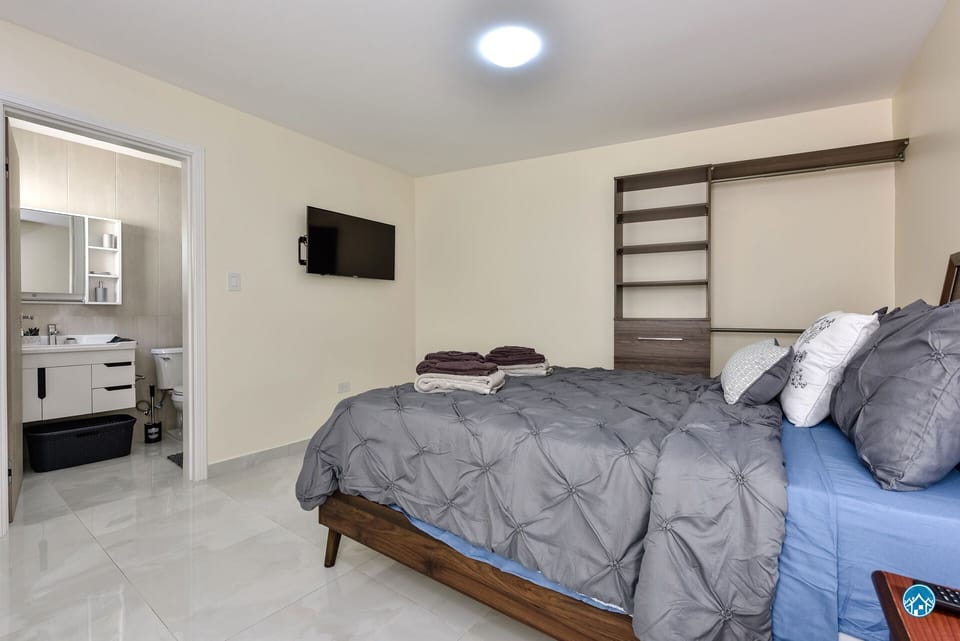 The 4th bedroom by the pool is airconditioned, has TV and a private bathroom