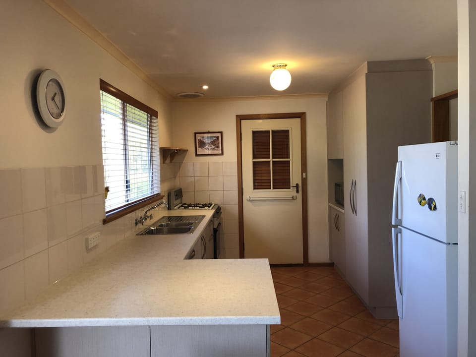 Newly renovated kitchen with gas oven. Dishwasher adjacent to kitchen.