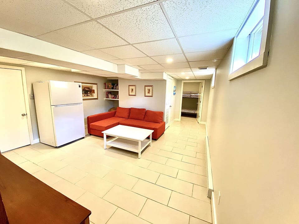 Lower level includes: 55” TV, extra (21 cu. ft.) refrigerator, & 2 sets of W&D.