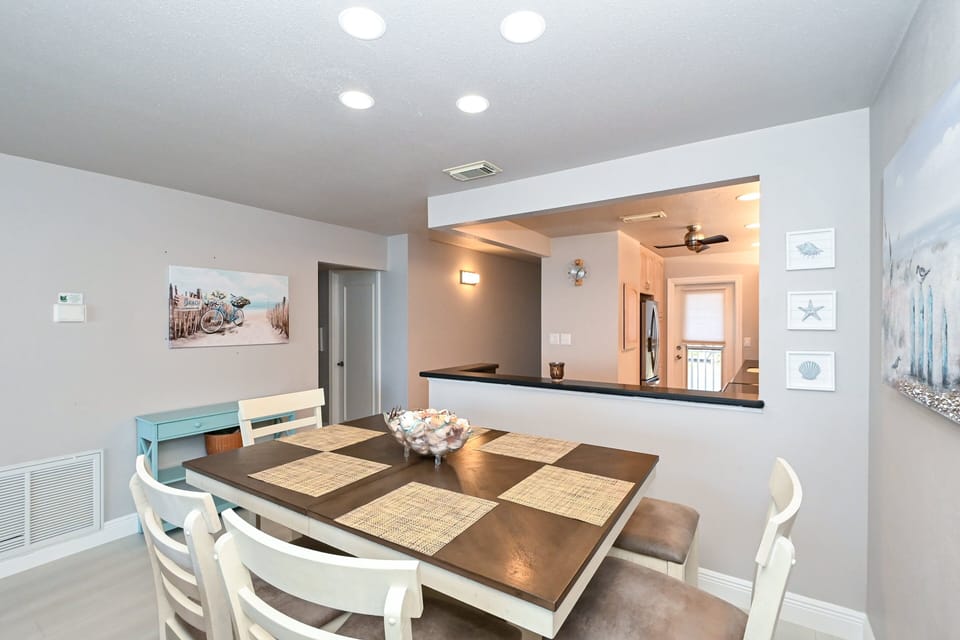 Dining area is right off the kitchen with seating for six