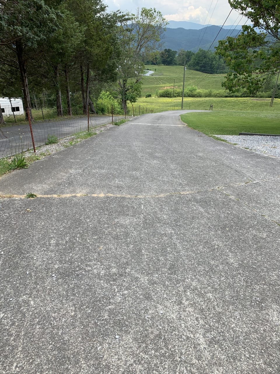 Driveway with ample parking. Additional gravel parking on side of driveway.