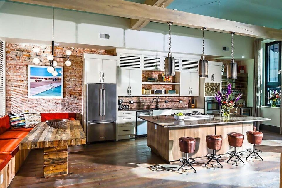 Kitchen with large island and dining booth. Great for entertaining friends