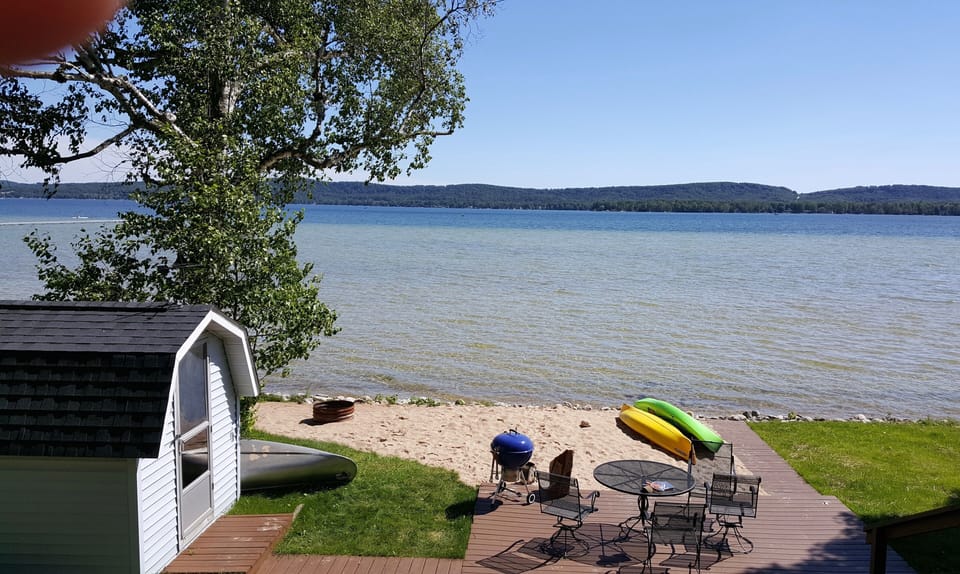 play on our beautiful private beach; grill at the water's edge; fire pit!