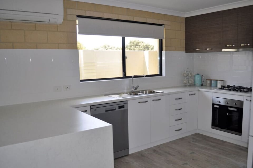 Fully equipped kitchen with dishwasher, oven and large fridge