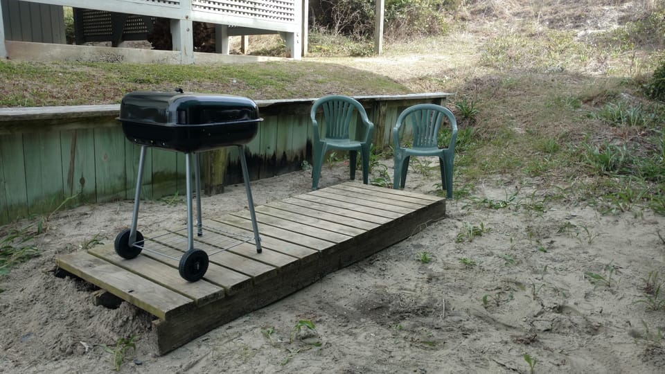 A convenient, level, shaded area for grilling a wonderful family meal.