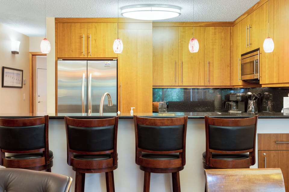 Kitchen is open to the living room/dining room with bar seating for four!
