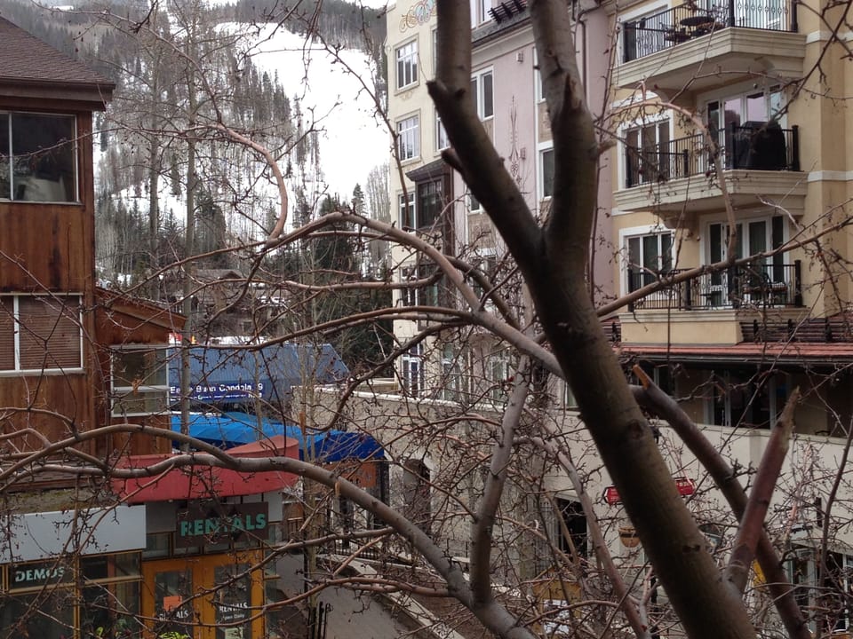 View of Vail Mountain, Arrabelle Hotel and Ski Shops/Bars from the balcony. 