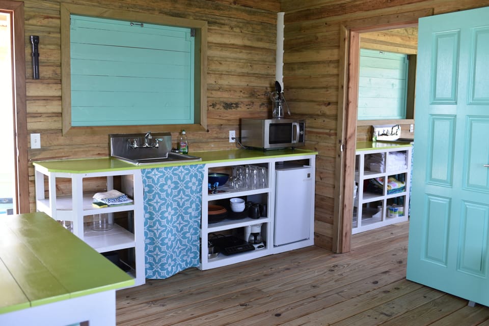 kitchen with mini fridge, microwave, and coffee maker