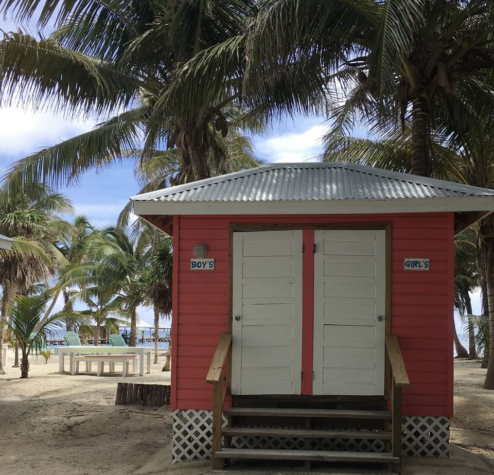 bathroom with flush toilets located on the beach - dock house left side photo
