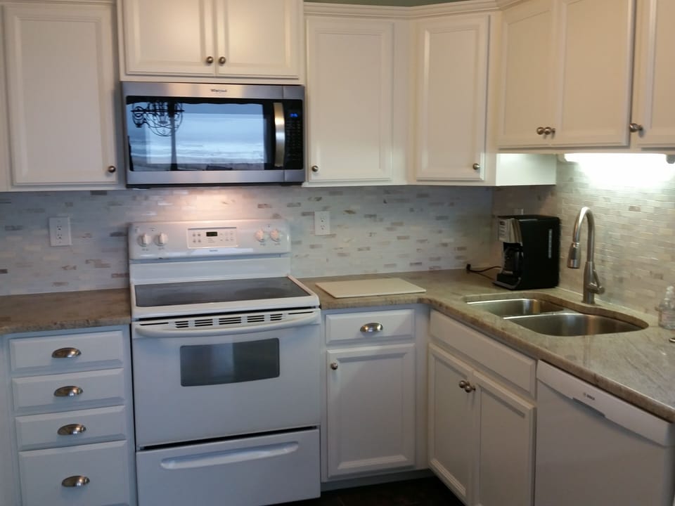 Upstairs main kitchen. Notice the reflection of the ocean on the microwave.
