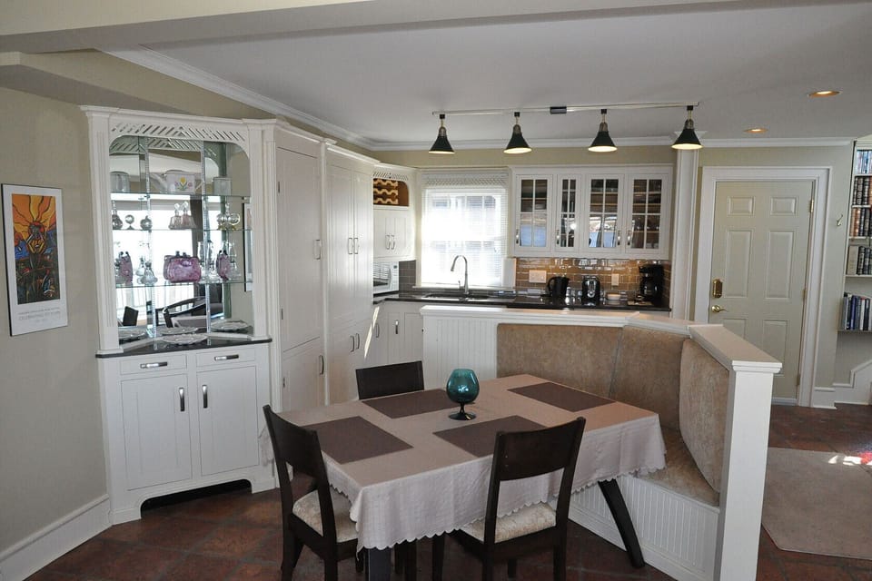 Dining Table with kitchen behind