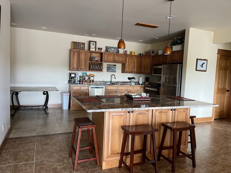 full kitchen and island for dining and family gathering