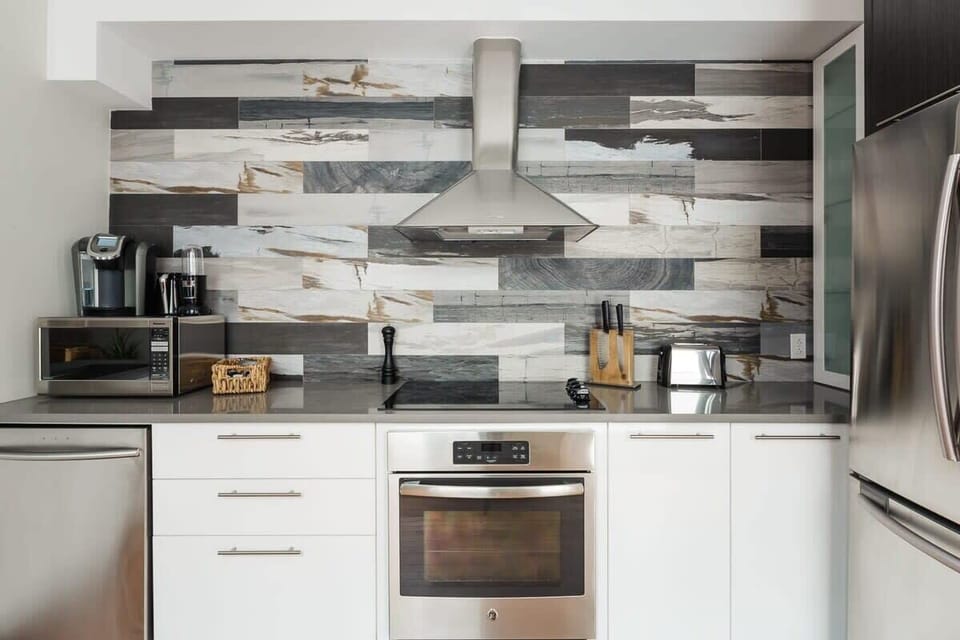 Open kitchen, dishwasher, keurig coffee machine with plenty of  pods