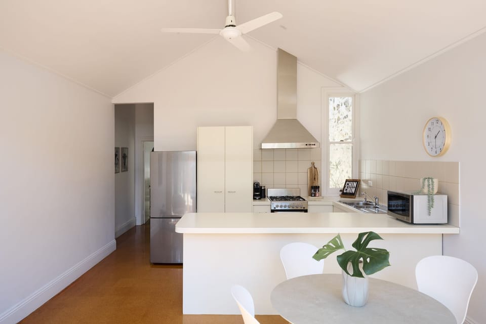 Bright, modern kitchen and meals area overlooking the rear courtyard.