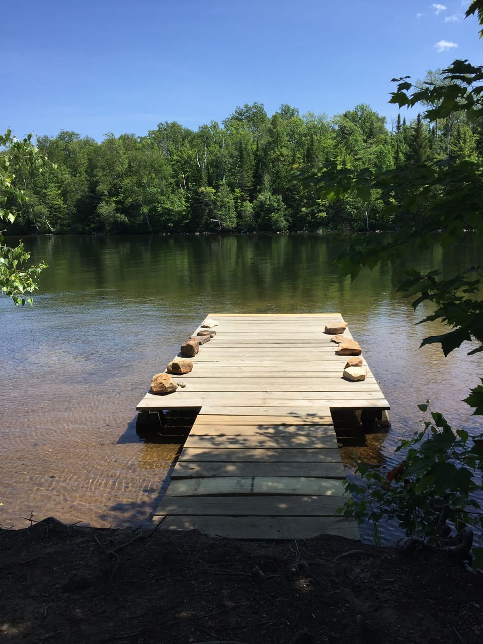 Large dock over shallow sandy bottom