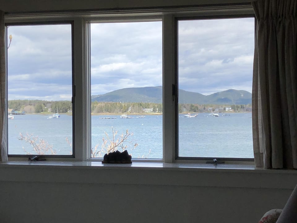 Living room windows looking out to the head of the harbor. 