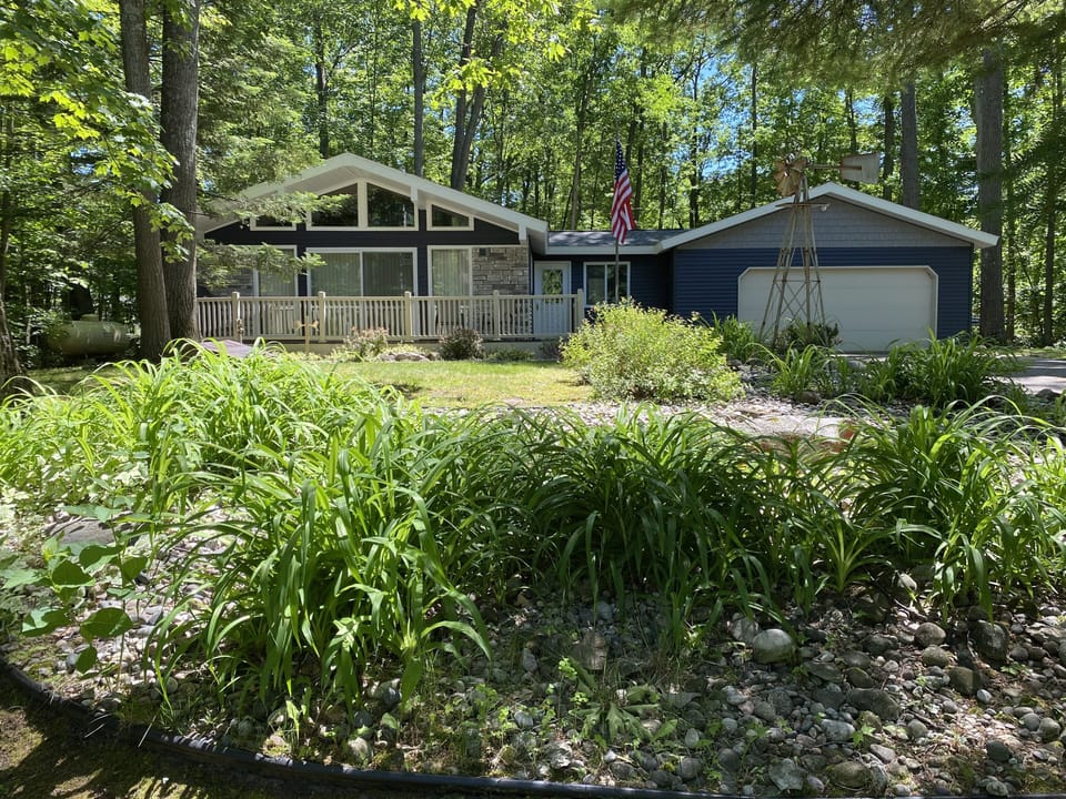 View from front of cottage. Cannot see the large yard or woods on both sides.