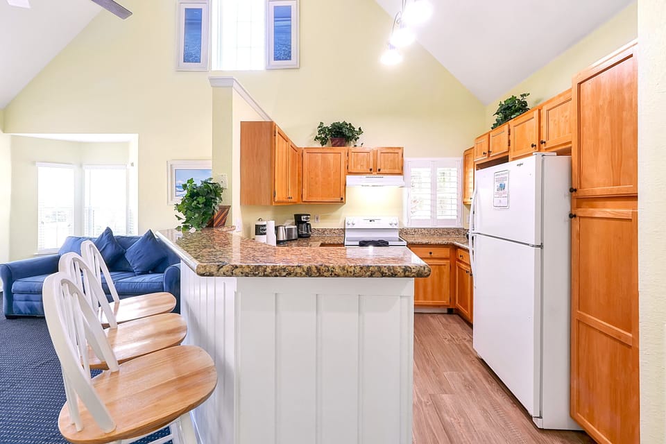 Roomy Kitchen with Granite Breakfast Bar. Carpet replaced with LVP flooring.