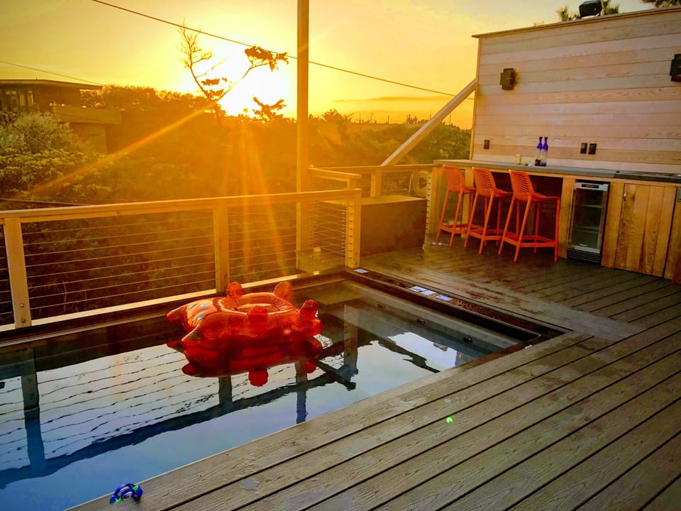 Enjoy relaxing sunsets in your own heated pool or at the bar.