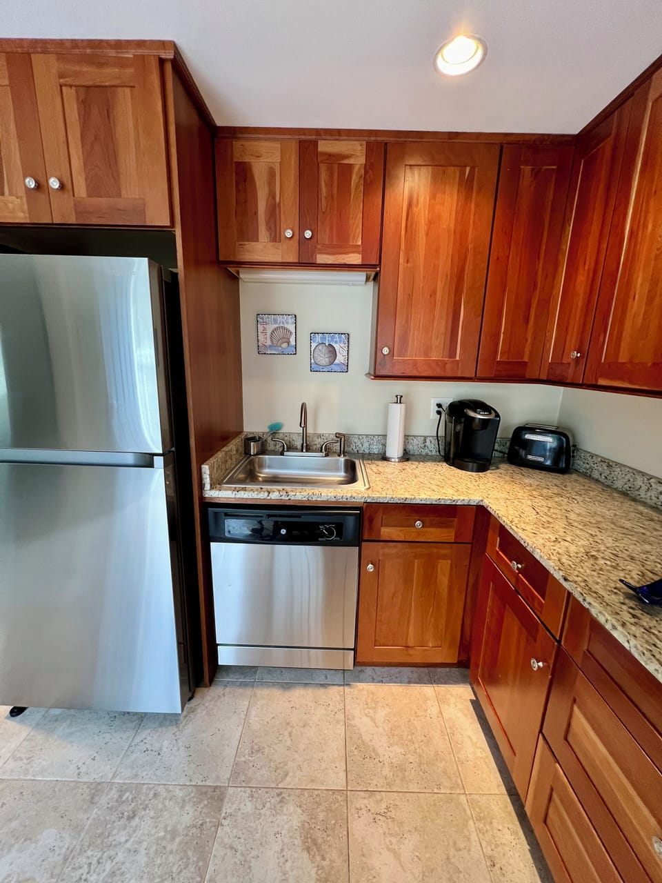 Kitchen area. Dishwasher, Keurig coffee maker, toaster, stovetop, microwave