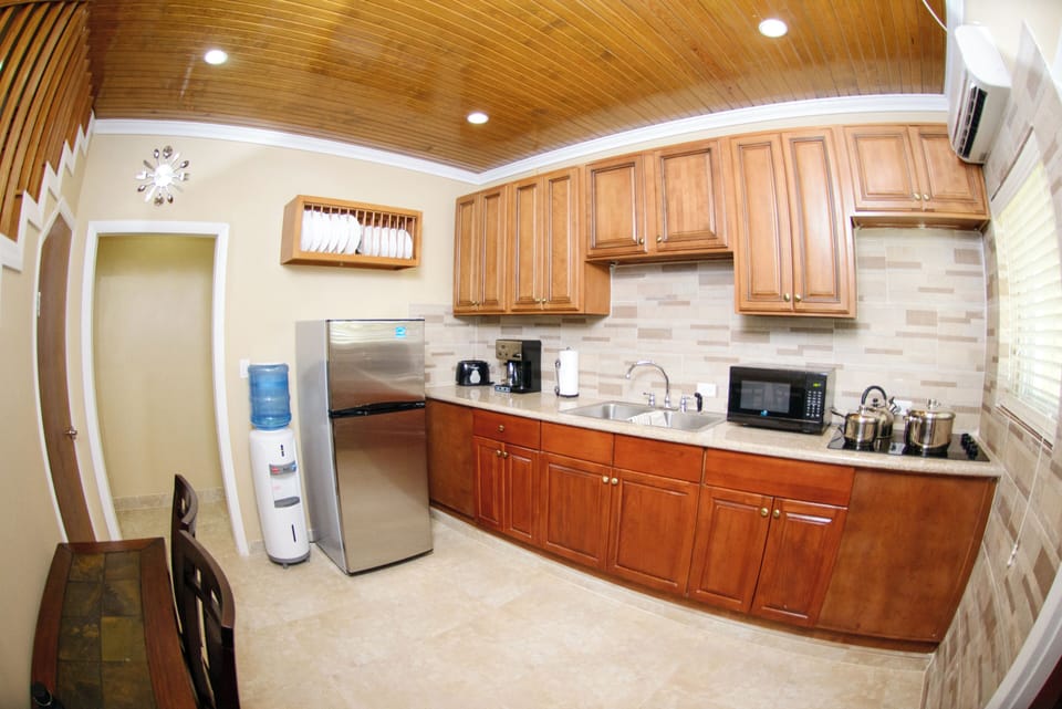 Kitchen area 2. Outfitted with stovetop and appliances.
