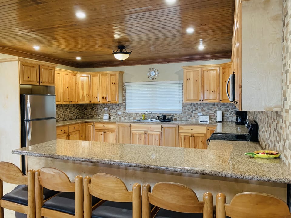Section 2:
Kitchen area. Large, open concept with breakfast counter.