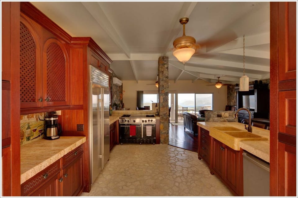 Gourmet Kitchen of Mahogany, Solid Travertine, Coral Stone & Luxury Applicances 