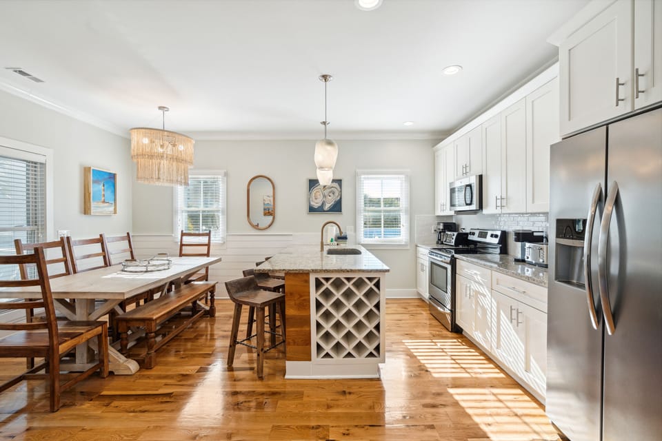 Open-concept living space with custom art and lighting will make you feel right at home
