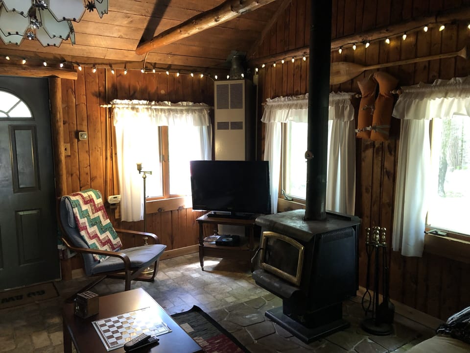 Cozy living room with wood burning stove for added heat 