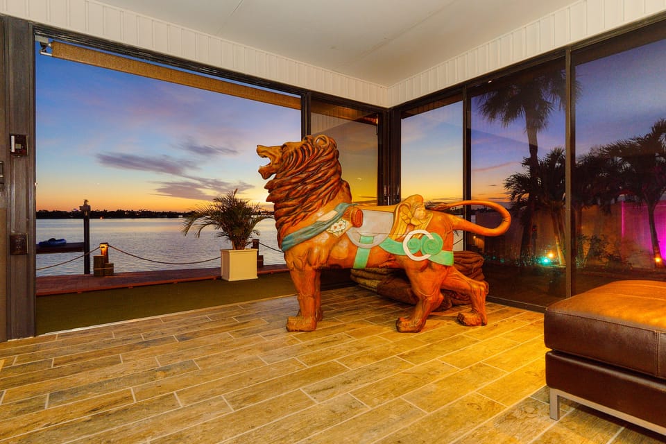 Antique carousel lion stands guard, adding charm and history to your stay.
