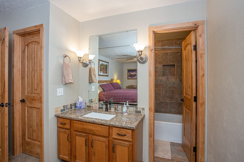 2 Queen bedroom ensuite in room with attached full bath & toilet.