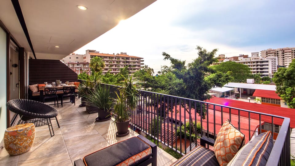 Full view of terrace with sweeping view of downtown, jungles, mountains, water