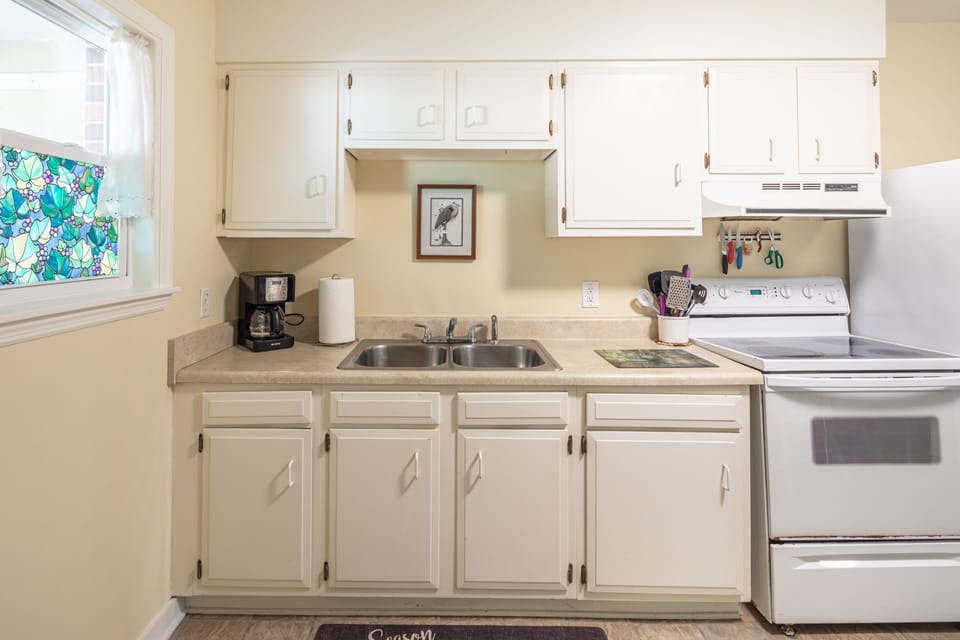 Fully equipped kitchen. Full Sized Refrigerator, Electric Oven and Range. 