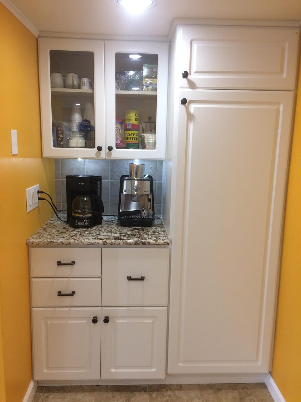 Coffee & tea available. Pantry cabinet in the kitchen