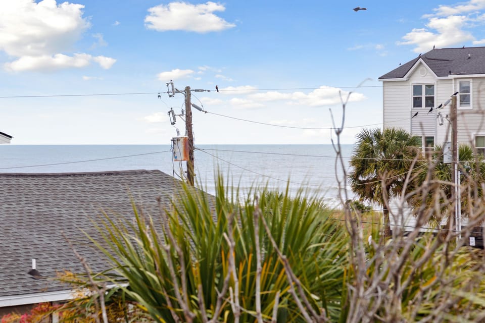 Sounds and glimpses of the Atlantic from your private primary suite balcony